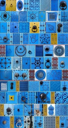 blue and yellow tiles with different designs on them