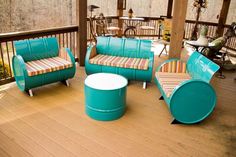 three chairs and two stools on a deck