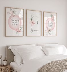 three framed pictures hang on the wall above a bed with white linens and pillows