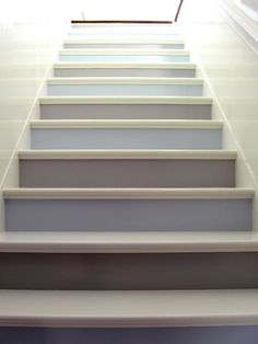 a set of white stairs leading up to the top