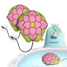 an inflatable flower pillow next to a swimming pool with a drawstring bag