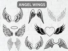 an angel wings set on a white brick wall