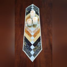 a tie with candles on it sitting on a table