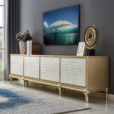 a living room scene with focus on the sideboard and large window in the background