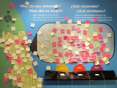 a bulletin board with post it notes on it and a map in the back ground