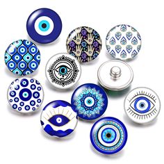 an assortment of blue and white glass knobs with evil eye designs on the front