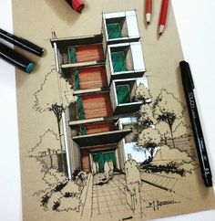 a drawing of a house on top of a piece of paper