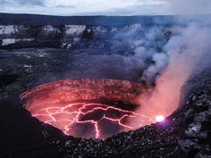 a crater with lava pouring out of it