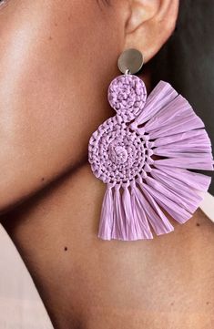 These Handcrafted Lavender Raffia Earrings are the perfect addition to any boho-inspired outfit. Made with love and attention to detail, each earring features a unique spiral shape, giving a touch of elegance and playfulness. The vibrant purple color will effortlessly complement any skin tone, making them perfect for any occasion. The fringes add a trendy and stylish touch, adding movement and texture to your look. With their unique design and boho style, these earrings are a must-have accessory Purple Bohemian Earrings For Beach, Handmade Adjustable Lavender Earrings, Purple Earrings For Summer Beach, Purple Handwoven Earrings As A Gift, Light Purple Earrings, Jewellery Patterns, Raffia Earrings, Boho Style Accessories, Spiral Shape