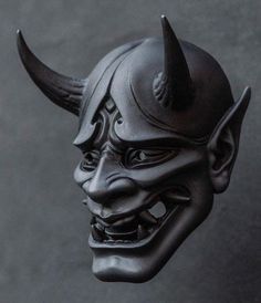 a black mask with horns on it's head