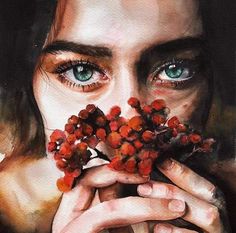 a painting of a woman holding berries in front of her face