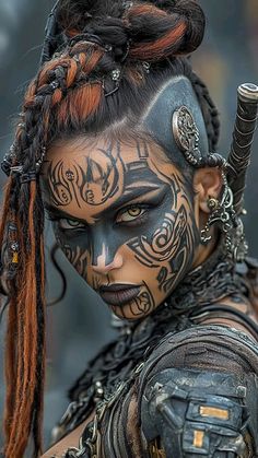 a woman with black and orange face paint, braids and tattoos on her head