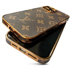 two cell phones sitting next to each other on top of each other in gold cases