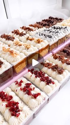 a display case filled with lots of different types of desserts on top of each other