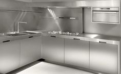 a kitchen with stainless steel appliances and counters