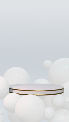 an image of a round object in the middle of some white balls that are floating