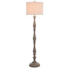 a floor lamp with a white shade on it