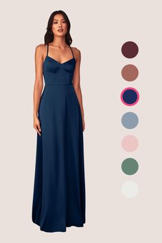 a woman in a long blue dress standing next to an assortment of color swatches