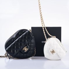 The Chanel CC In Love bags are the ultimate statement piece for any fashion-forward individual. Their heart-shaped design and classic Chanel details make them a must-have for any handbag lover. The white lambskin leather version, known as the "Clutch with Chain," is a perfect example of the brand's iconic style. The quilted leather, interwoven leather and chain strap, and CC turnlock closure all come together to create a truly luxurious piece. And with its mini size of just 4.7 inches across and Chanel Details, Jimmy Choo Clutch, Heart Shaped Bag, Chanel Clutch, Bag Illustration, Classic Chanel, Designer Clutch Bags, Womens Designer Handbags, Heart Bag