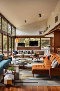 a living room filled with furniture and lots of windows