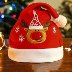 a red santa hat with reindeer's head on it