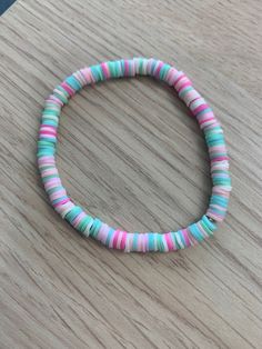 a close up of a bracelet on a table