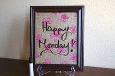 there is a sign that says happy monday with pink flowers on the front and bottom