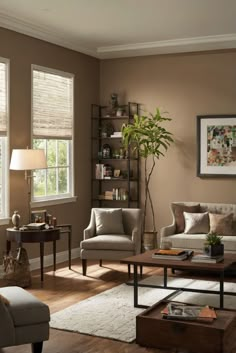 a living room with two couches and a coffee table in front of the window