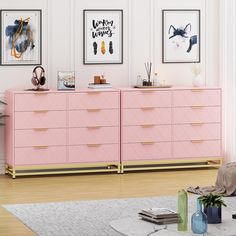 a living room with pink dressers and pictures on the wall above them in various frames