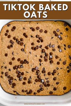 a close up of a baked oatmeal in a baking pan with chocolate chips