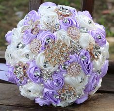 a bridal bouquet with purple and white flowers