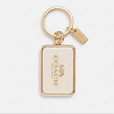 Coach Key Chain, Purse Charm, Hang Tag. Brand New. Never Used. In Original Packaging. Cream Trimmed In Brilliant Bold Gold. It Feels Like You’re Holding A Bar Of Gold!!! Fabulous Key Chain! Sophisticated And Rich! Color: Chalk Horse And Carriage, Keychain Fob, Keychain Wallet, Ring Bag, List Ideas, Cute Keychain, Coach Accessories