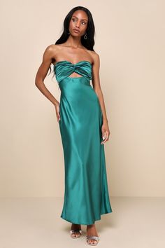 You'll be looking especially extraordinary in the Lulus So Rare Emerald Green Satin Strapless Twist-Front Midi Dress! Glossy woven satin shapes this head-turning dress that falls from a strapless, sweetheart neckline (with hidden no-slip strips) into a pleated, twist-front bodice that creates a flirty cutout. The high, fitted waist sits atop a figure-skimming slip skirt that finishes at a chic midi hem. Turn around to reveal two elasticized straps that lay across the otherwise open-back design. Long Guest Wedding Dress, Open Back Wedding Guest Dress, Pre-draped Satin Strapless Dress For Gala, Strapless Pre-draped Satin Maxi Dress, Pre-draped Satin Strapless Cocktail Dress, Pre-draped Satin Strapless Party Dress, Formal Pre-draped Strapless Satin Dress, Silk Strapless Dress With Fitted Bodice, Pre-draped Silk Strapless Dress With Fitted Bodice