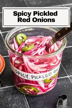 pickled onions in a glass jar with the words spicy pickled onions on it