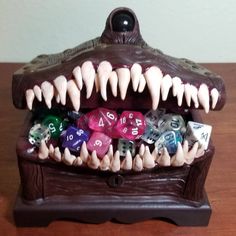 a wooden table topped with lots of dice