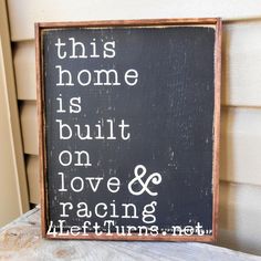 a sign that says this home is built on love and racing lifeturns not