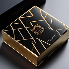 a black and gold box sitting on top of a table