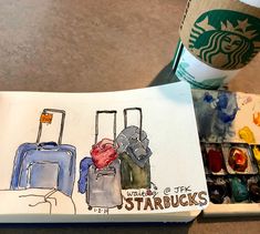 a starbucks coffee cup next to a drawing of suitcases with the words starbucks written on them