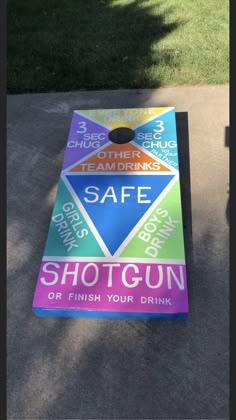 a colorful cornhole game sitting on top of a sidewalk