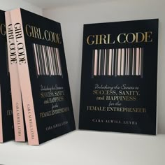 three books with bar code covers on them