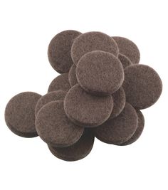 a pile of brown felt discs sitting on top of each other