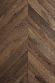 an image of wood flooring that looks like herringbones or chevron boards