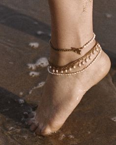 An ode to pearls. Michel, the belle of pearls. Timeless elegance and classic simplicity wrap your leg in this dainty "rice" pearl anklet. Pair with a herringbone chain for maximum impact. The little sister to the best-selling Michel Necklace, the anklet version is the perfect "Southern" addition to your jewelry game all summer long. Available in 9.5" and 10.5". Not sure of your size? Take a string and use it to measure a comfortable point around your ankle. Then hold that string to a ruler to de Elegant Pearl Anklets For Party, Gold Pearl Anklet With Pearl Charm, Delicate Pearl Chain Anklets, Elegant Gold Pearl Bracelet For Summer, Elegant Adjustable Anklets With Pearl Charm, Pearl Chain Anklet For Party, Elegant Adjustable Pearl Anklets, Elegant Pearl Anklets With Pearl Chain, Elegant Pearl Chain Anklets