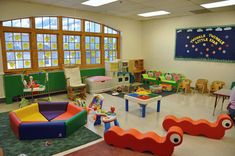 children's playroom with colorful furniture and large windows