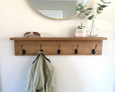 a coat rack and mirror on a wall