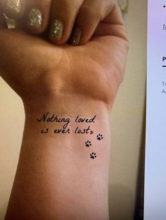 a woman's wrist tattoo with the words nothing loved is ever lost