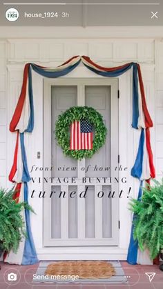 an american flag wreath on the front door of a house