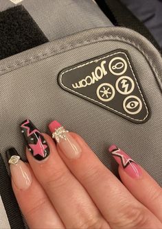 Black and pink 2000’s inspired nails with black stars and white star liner, silver planet and leaf charms with pink and black French tips Black Star Nails Acrylic Y2k, Y2k Nails Without Charms, Pink Black Star Nails, Y 2k Nails, 2000s Star Nails, 2000s Nails Aesthetic, Y2k Nail Designs Acrylic, Pink Black Nails Ideas, Star Nails Pink And Black