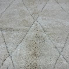 an area rug that looks like it is made out of sheepskin and has been cleaned