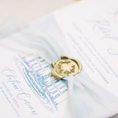 a wax stamp on top of a wedding card